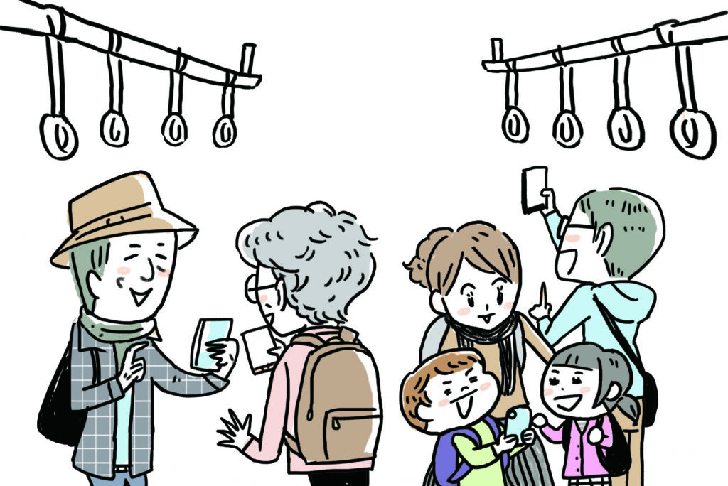 スマホをかざす旅行者たち、つり革